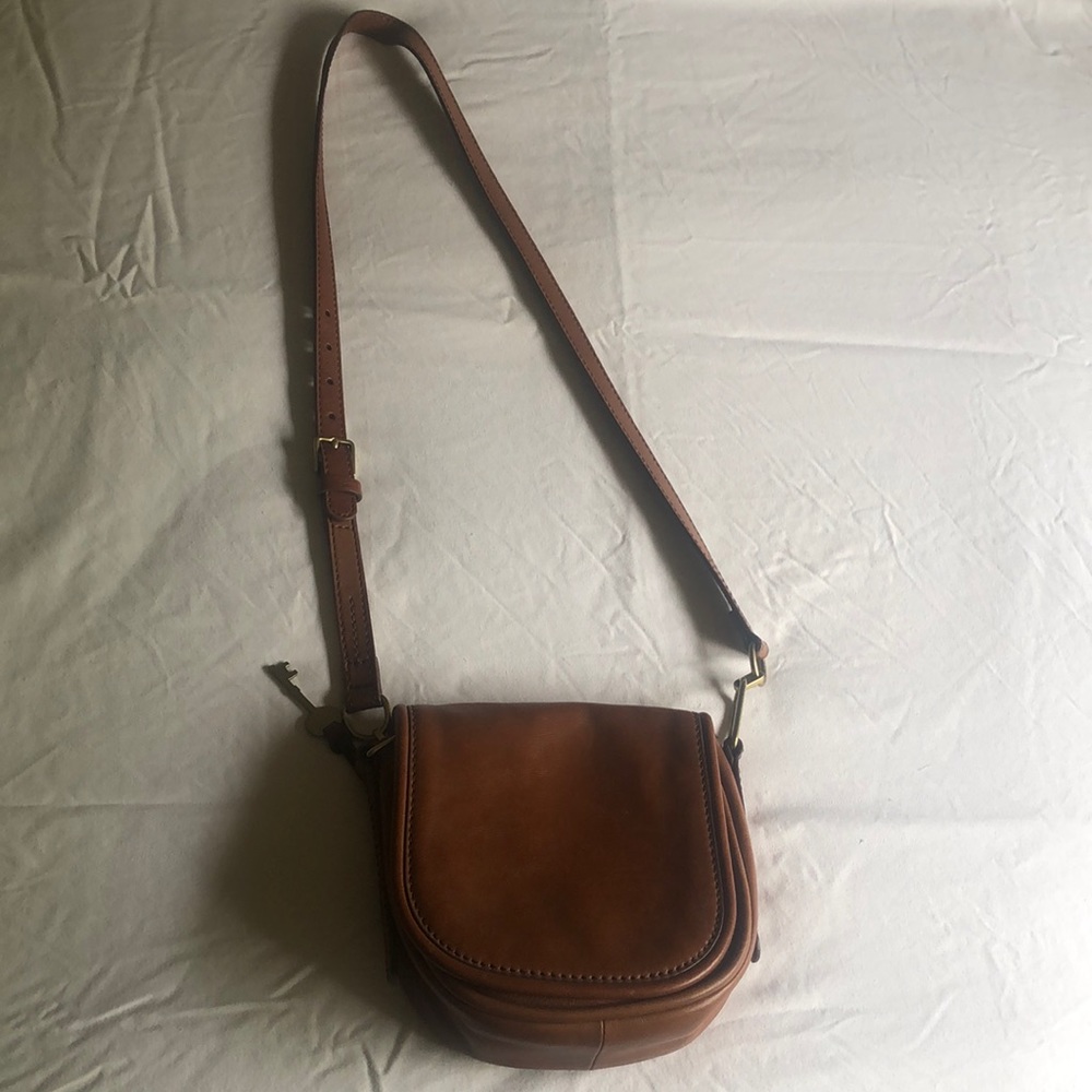 Fossil purse. 7 inches x 7 1/2 inches   Strap 20 inches long.